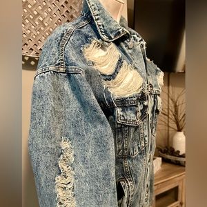 Hi, you’re looking at a long sleeve distressed, jean jacket
